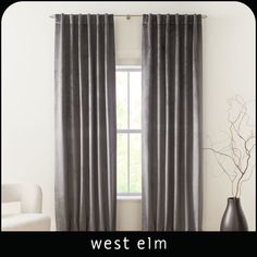 the west elm curtains are ready to be hung on the wall in the living room