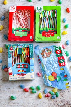 three boxes of candy on a wooden table