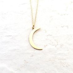 Solid bronze crescent moon pendant is hung on 14K Gold Filled chain. A simple celestial jewelry piece for everyday wear.Moon measures just over 1 inch tall (27mm).Necklace in pictures is 16 inches (40.64).As a symbol, the moon represents clarity and reflection. Her wisdom is gained through quiet introspection and contemplation of self as she reflects the light of the sun.\\\What is gold-filled?///Gold filled components are made in the USA and have a thick layer of gold. It is bonded to an inner Everyday Half Moon Phase Necklace, Everyday Half Moon Charm Necklace, Minimalist Half Moon Phase Necklace, Everyday Celestial Half Moon Necklace, Celestial Half Moon Necklace For Everyday, Minimalist Jewelry With Moon Charm, Everyday Celestial Crescent Necklace, Celestial Crescent Necklace For Everyday, Everyday Minimalist Crescent Necklaces