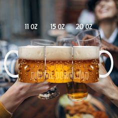 two people toasting with beer glasses in front of them