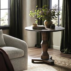 a living room scene with focus on the table and chair in the foreground,