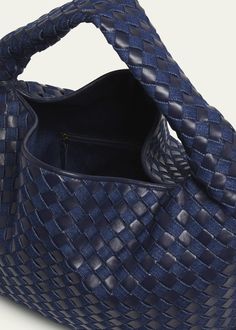 "Find BOTTEGA VENETA Large Hop Denim Hobo Bag on Editorialist. The Bottega Veneta \"Hop\" hobo bag is crafted from denim intrecciato cotton and leather. It features a shoulder strap, a foldover flap top with an interior zip pocket, and measures approximately 9.4\"H x 21.2\"W x 5.1\"D. Made in Italy." Designer Blue Shoulder Bag With Woven Leather, Designer Blue Woven Leather Shoulder Bag, Designer Blue Shoulder Bag With Braided Handles, Designer Blue Bags With Braided Handles, Wishlist Idea, Denim Hobo Bag, Indigo Bag, Large Hobo Bag, Bottega Veneta Shoulder Bag