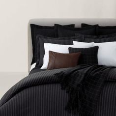 black and white bedding with brown pillows