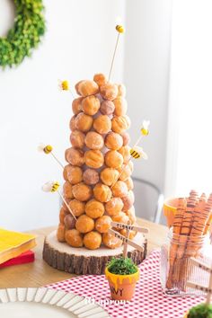 donuts stacked on top of each other in the shape of a tower sitting on a table