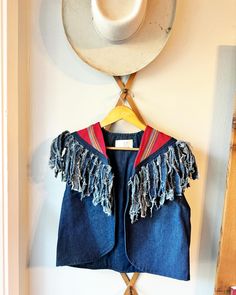 "Adorable Dark Denim Southwest Tapestry Fringe Vest by Mustard Seed Designs. Made in Texas.  No size tag. Length: front 18.5\" back: 20\" Underarm to underarm: 19.5\" no closure. Check out the rest of our shop: https://instagram.com/hollyshopvintage?igshid=OGQ5ZDc2ODk2ZA== https://hollyshopvintage.etsy.com/ Orders over $35 ship for free. Please check out my Instagram for my newest finds: Hollyshopvintage  Everything priced over $35 has shipping already included in the total price. I'll gladly combine shipping on multiple items to save you money, when it is safe to do so! Message me to make adjustments ahead of time, or make your purchase and I'll refund the shipping overages.  Most items are Vintage. Expect some vintage wear. Items may contain unmentioned flaws.  I only post items that hav Bohemian Cotton Denim Vest For Festivals, Bohemian Medium Wash Denim Vest For Festival, Blue Bohemian Denim Vest For Festivals, Fitted Bohemian Denim Vest In Medium Wash, Elf Boots, Forest Elf, Fringe Vest, New Braunfels, Vest Outfits