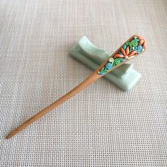 This is an order to make list, please allow 2 weeks before shipping. Crafted from pure natural ebony wood, the hairpin measures 18cm in length.  This elegant hairpin is made from natural peach wood, featuring hand-sculpted polymer clay fortune floral pattern on both sides. Its 3D design and unique Oriental charm make it a standout piece.  Available in two sizes: 18cm Unique gift you can choose for yourself, or your family and friends :-) Clay Peach, Chinese Hair Stick, Chinese Hairpin, Chinese Hair, Hair Fork, Chinese Hairstyle, Hair Stick, Ebony Wood, Hair Sticks