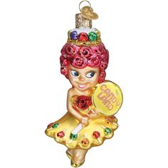 Princess Lolly is the ruler of Candy Land, and now she can grace your Christmas tree! This ornament features Princess Lolly in a yellow dress with lollipops and her pink curly hair with a colorful crown on top. This glass Christmas ornament is hand-painted and glittered in a series of labor-intensive steps to achieve this beautiful creation. Perfect for hanging on a Christmas tree, adding a personal touch. Candyland Princess, Princess Lolly, Candyland Games, Modern Christmas Ornaments, Festive Centerpieces, The Resident, Fun Ornaments, Candy Christmas Decorations