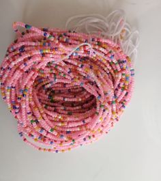 Pink Themed Wholesale African Waistbeads Waistbeads Vendor | Etsy Multicolor Waist Beads For Beach, Multicolor Waist Beads For The Beach, Multicolor Round Waist Beads For Beach, Multicolor Faceted Beads For Jewelry Making, Pink Spacer Beads For Crafting, Pink Bohemian Heishi Beads, Bohemian Pink Heishi Beads, Handmade Waist Beads For Beach, Pink Waist Beads With 108 Beads As A Gift