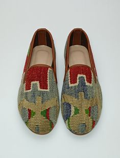 Welcome to AliDesignStore This Kilim Loafer one -of-A-kind! Upper Made of a Hand-Selected Vintage Turkish Kilim Rug .  Kilims Rugs Are Hand Crafted From Vegetable Yarn. Have Stronger weave. - Handcrafted - Materials : Handwoven Kilim Rug                       Leather Sole                        Leather Trimmed                       Leather Lining                       Stacked Leather Sole                       Rubber Under The Stacked Heel  Care:   Soft Clothing Brush İs Recommended To Clean The Slipper. İf Something Spill on it.You Can Clean İt a Cloth With shampoo. - Ships from a small business in Turkey Leather Sole Slip-ons With Flat Heel For Galas, Multicolor Leather Slip-on Loafers, Brown Loafers With Red Sole And Round Toe, Multicolor Leather Loafers With Flat Heel, Multicolor Slip-on Loafers With Rubber Sole, Closed Toe Loafers With Branded Insole For Galas, Galas Slip-on Tassel Loafers With Rubber Sole, Casual Multicolor Slip-on Loafers, Stitched Sole Closed Toe Loafers For Galas