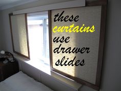 there is a sign on the wall in this bedroom that says, these curtains are drawer slides