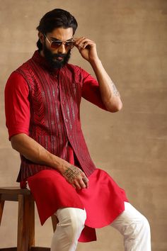 Red hued waistcoat style nehru jacket with striped embroidery.
Component: 1
Pattern: Embroidered
Type Of Work: Stripes
Neckline: Band Collar
Sleeve Type: Sleeveless
Fabric: Tussar
Color: Red
Other Details: 
Front button down
Sequins work
Note: Kurta and pant worn by the model is not for sale
Occasion: Wedding - Aza Fashions Raghavendra Rathore, Waistcoat Style, Embroidered Waistcoat, Waistcoat Men, Nehru Jacket, Nehru Jackets, Jodhpur, Band Collar, Aza Fashion