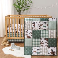 a baby crib bedding set with a green and white checkered blanket on the floor