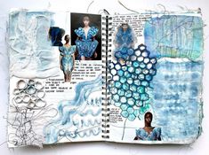 an open book with blue and white designs on it's pages, including watercolors