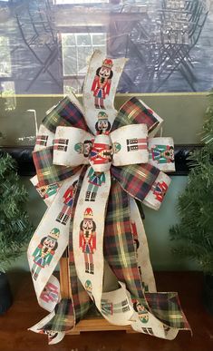 a christmas bow on top of a wooden table