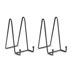 three black metal racks on white background