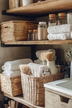 bathroom shelves with towels, soaps and other personal care items in baskets on them