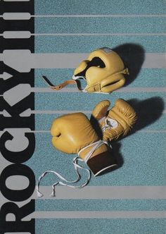 two yellow boxing gloves are on the ground