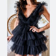 Make A Bold Statement In This Tulle Mini! Whether It's For Your Birthday Or Just To Feel A Bit Extra Girly, You Can't Go Wrong With This One. 100% Polyester Color: Black V Neck Tulle Mini Dress Tiered Tulle Detail Light Weight Size Zipper Closure Visible Lining True To Size Laying Flat Bust Measures 18.5”, Length 32” And Waist Is 14”. Tulle Black Dress, Tulle Mini Dress, Hooded Dress, Bow Detail Dress, One Clothing, Long Sleeve Mini, Fitted Skirt, School Fashion, Kimono Fashion