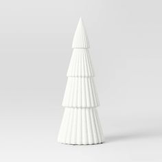 a white ceramic christmas tree on a gray background