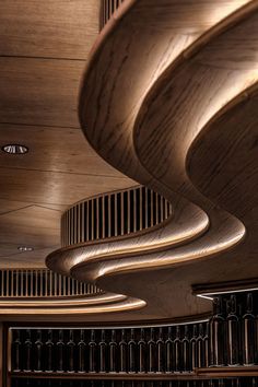 an artisticly designed wooden staircase in a wine cellar