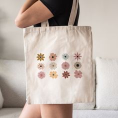 This Floral Tote Bag is a stylish upgrade to reusable tote bags. This Flowers canvas tote bag make a great reusable tote for yourself or as a gift tote for plant lovers. ⚡ USA fast delivery. We deliver within a week. ⚡ Our Tote Bags are made with 100% cotton sheeting. Add their reinforced handle stitching to the mix, and you got a reliable bag rich in both practicality and durability. These durable totes are crafted with a last technological DTG printer for a vibrant flawless finish. Tote bags w Trendy White Flower-shaped Bag, Trendy Flower-shaped Bag For Gifts, Trendy Flower Shaped Shoulder Bag For Everyday, Trendy Flower-shaped Everyday Shoulder Bag, Trendy Flower Shaped Everyday Shoulder Bag, Pink Reusable Tote Bag, Eco-friendly Everyday Bags With Floral Print, Eco-friendly Rectangular Bag With Floral Print, Daily Use Flower-shaped Bag With Removable Pouch