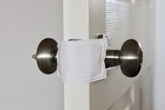 a close up of a door handle with a white cloth on it