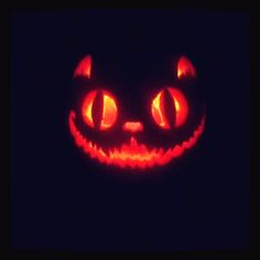 a pumpkin with glowing eyes in the dark