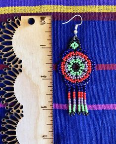 These chaquira beaded earrings make the perfect colorful and joyful statement accessory for any outfit you choose! Select your earrings by the letter according to photos.**Listing is for 1 pair of earrings only**All items are made with love by talented skilled artisans. Because of the handmade nature of the items, they may have some imperfections. However, this is what makes them one of a kind! Mexican Palm, Gift For Mom Birthday, Feminist Gift, Earrings Beaded, Embroidered Hats, Colorful Earrings, Mom Birthday, Mom Birthday Gift, Hand Painted Ceramics