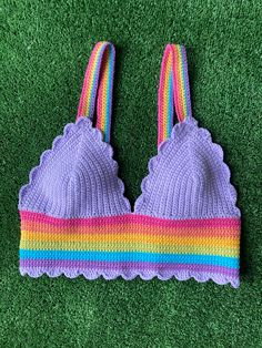 a purple knitted bra with rainbow stripes on it