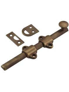 an old style door handle and latch with two screws on each side, set against a white background