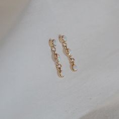 A little bit of dangly fun and iridescence✨ Synthetic opal and 14k yellow gold filled Earring length is 3/4" Gold Opal Drop Earrings, Dainty Hypoallergenic Opal Earrings, Minimalist Hypoallergenic Opal Earrings, Gold Hypoallergenic Opal Jewelry, Dainty White Opal Earrings, Hypoallergenic Gold Opal Jewelry, White 14k Gold Filled Long Drop Linear Earrings, 14k Gold-filled White Linear Long Drop Earrings, White 14k Gold Dangle Linear Earrings