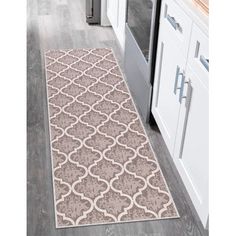 a large rug in the middle of a kitchen