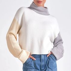 Stay warm and stylish with this colorblock turtleneck sweater. Featuring a rib-knit design and trendy colorblock pattern in white, grey and yellow, this pullover will keep you cozy and on-trend all season long. Perfect for any occasion, feel confident and fashionable with this must-have sweater. Available in sizes: S, M, and L Formal Dress Shops, Black Dress Formal, Outerwear Vest, Athleisure Wear, Beige Sweater, Sweater Sale, Color Block Sweater, White Maxi Dresses, Jacket Sale