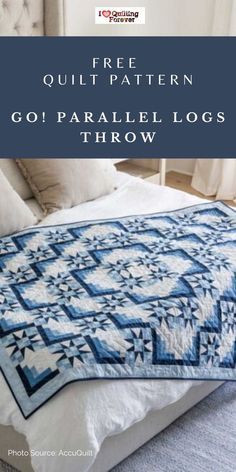 a bed with a blue and white quilt on it