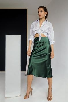 Slip skirts are this season’s perfect alternative to your everyday jeans. Not only do they go with anything, but they’re also comfortable and very on-trend this spring. Reminiscent of the ‘90s, the silk slip is back with a vengeance—and we’re here for it. Something about the shiny fabric can transform even a basic t-shirt outfit into a super-chic look, so we feel justified in dubbing it wardrobe staple that belongs in every closet.Color: forest greenone layer of real silkXS/S/M/L/XLbias cutAll o Green Knee-length Skirt For Night Out, Summer Silk Skirt With Bias Cut, Green Midi Skirt For Night Out, Elegant Green Skirt For Night Out, Elegant Green Pencil Skirt, Green Silk Lined Skirt, Silk Skirt Outfit Summer, Green Satin Skirt Outfit, Satin Skirt Outfit Summer