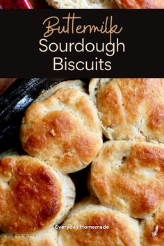 buttermilk sourdough biscuits in a cast iron skillet with text overlay