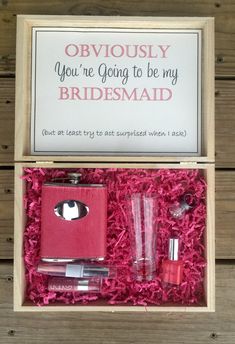 a pink box with two bottles and a flask in it that says, seriously you're going to be my bridesmaid