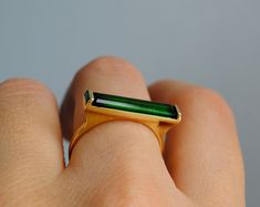 Forest Green Tourmaline 14K Yellow Gold Ring Minimal, Natural Bar Gemstone Chrome, October Birthstone Birthday Gift Wife Mother's Day - Etsy Modern Polished Emerald Ring For Gift, Modern Polished Emerald Ring Gift, Modern Emerald Ring With Polished Finish For Gift, Modern Emerald Ring With Polished Finish As Gift, Elegant Rectangular Tourmaline Ring, Modern 14k Gold Emerald Ring, Modern Emerald Ring With Tension Setting As Gift, Modern Baguette Cut Emerald Ring, Modern Tourmaline Emerald Ring As Gift