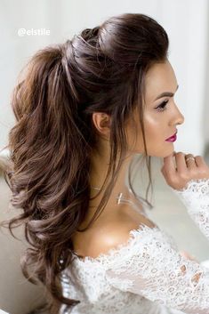 a woman with long hair in a white dress