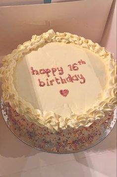 a happy 16th birthday cake with white frosting and sprinkles in a box