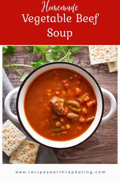 a bowl of homemade vegetable beef soup with crackers on the side