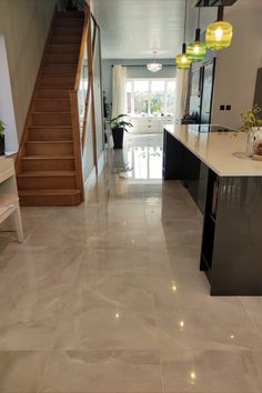 Atelier Mirror Polished large format porcelain tile lead in an open-plan kitchen and dining design. Tiles For Living Room Floor, Kitchen Tiling, Tiling Ideas, Hall Tiles, Marble Effect Tiles, Living Room Tiles, Large Tile, Luxe Style