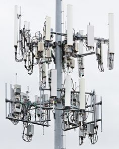 multiple cell towers are connected to each other with wires and plugs in the middle