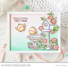 a card with two birds and a birdhouse