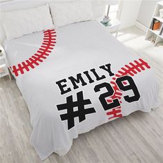 a baseball themed bed spread with the number twenty nine and two stitches printed on it