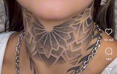 a woman with tattoos on her neck and chest