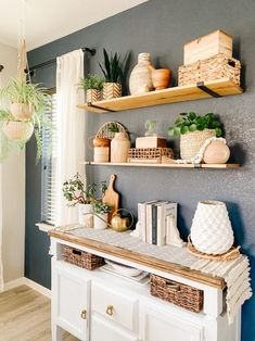 the shelves are filled with potted plants and other decorative items on top of them