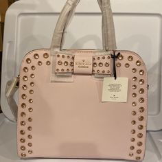 New! Gorgeous Plumdawn (Pink) Handbag Size 10.5"H X 12.7"W X 5.1"D Drop Length: 5" Handheld Adjustable Strap Length: 32" Material Soft Crosshatched Leather With Matching Trim Capital Kate Jacquard Lining 14-Karat Light Gold Plated Hardware Style # Wkru4768 Details Satchel With Zipper Closure Interior Zipper And Double Slide Pockets Studded Embellishments Kate Spade New York Signature On Front Bow Dust Bag Not Included Designer Pink Top Handle Bag, Luxury Pink Bag With Top Carry Handle, Pink Evening Satchel With Dust Bag, Pink Leather Satchel, Luxury Pink Handheld Bag, Luxury Pink Handheld Bags, Luxury Handheld Pink Bag, Luxury Pink Shoulder Bag With Top Carry Handle, Blush Shopping Bag With Top Carry Handle