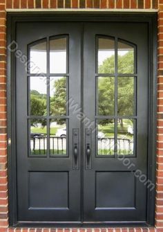 a black double door with two sidelights