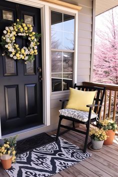 the front porch is decorated with yellow and white flowers